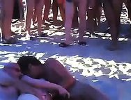 My slutty Wife being shared at Cap d'Agde beach.