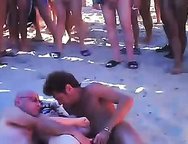 My slutty Wife being shared at Cap d'Agde beach.